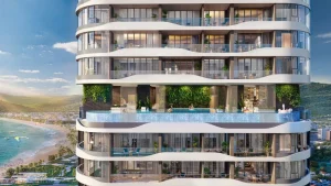 Cận cảnh mặt đứng tháp đôi Q Terra với ban công cong và hồ bơi xen tầng